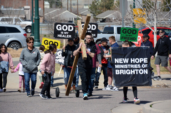 Brighton Residents Carry the Cross of Jesus Christ