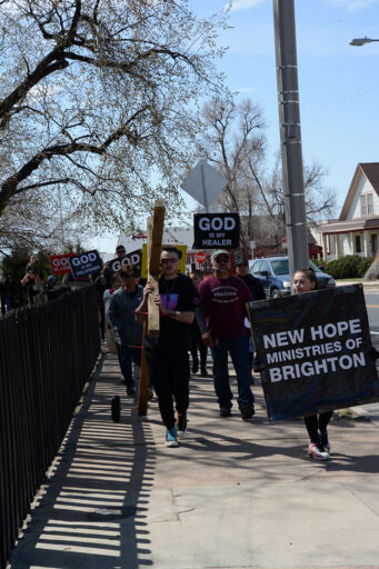 Brighton Residents Carry the Cross of Jesus Christ