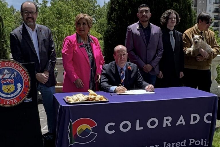 Polis signed his last bill surrounded by mariachis and tamales